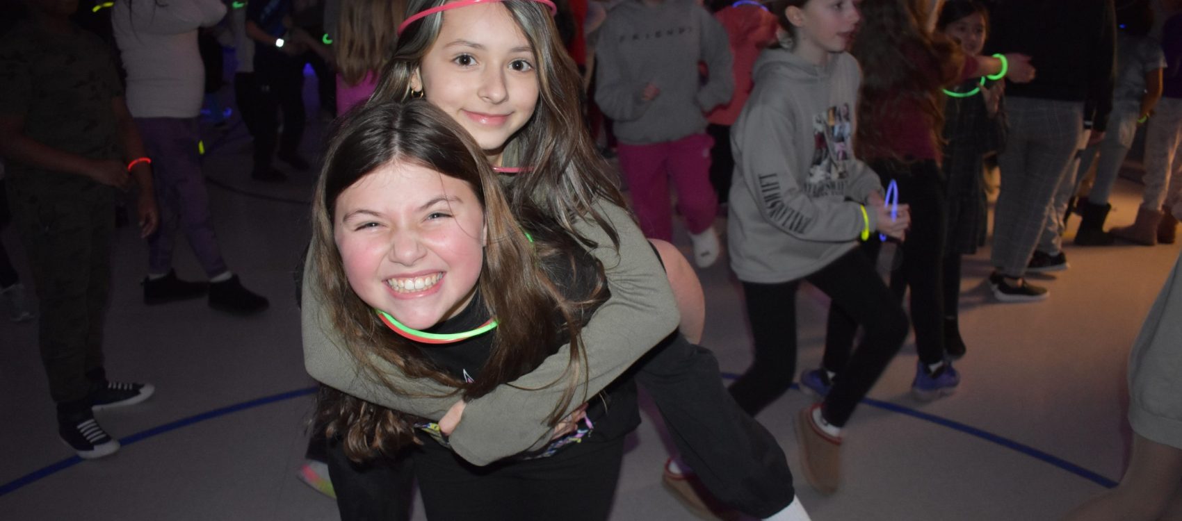 two students at the Shoemaker Glow Party