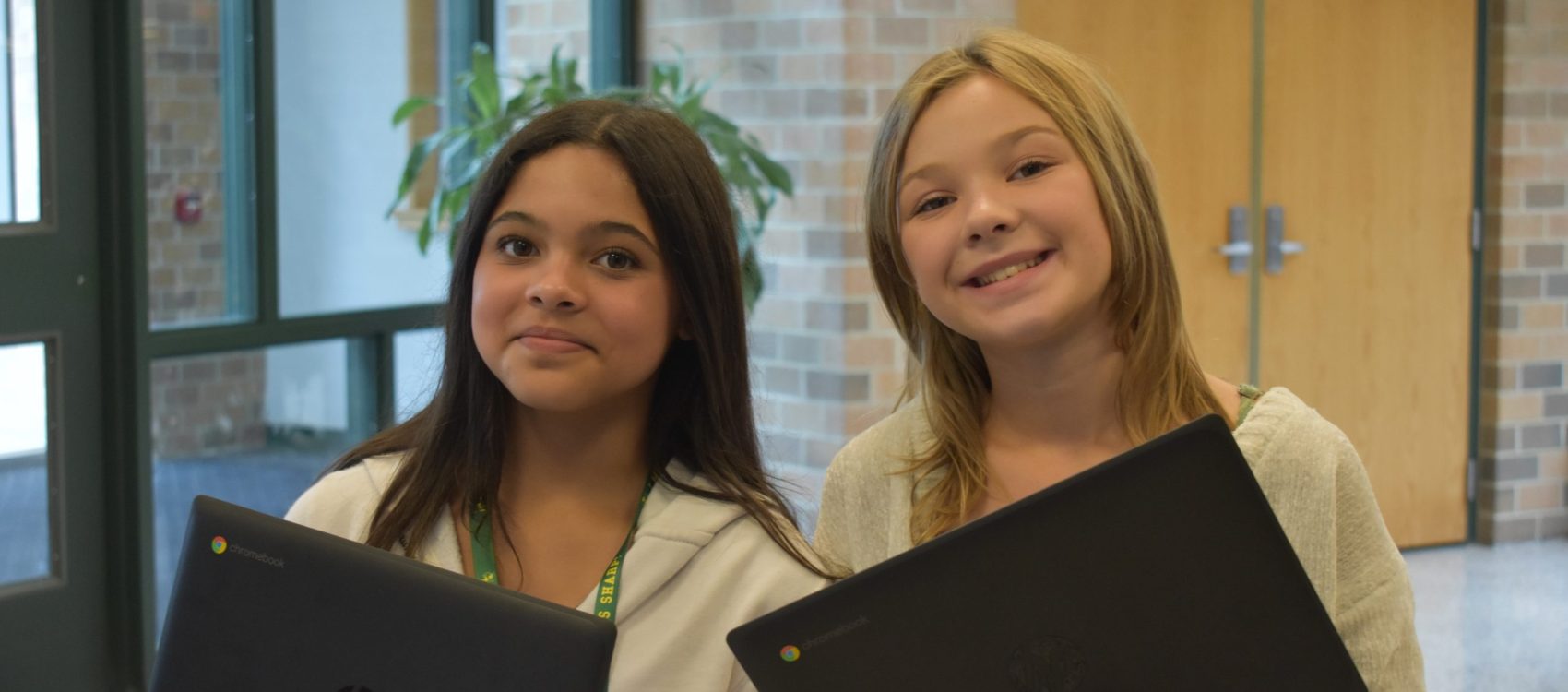 Middle School Students Holding Chromebooks